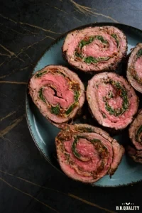 Gevulde bavette rollade in plakken gesneden - Porties vlees per persoon verdelen